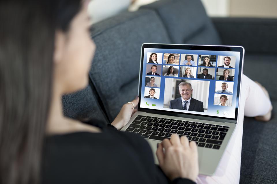 Young Woman on Video Conference on laptop computer at home