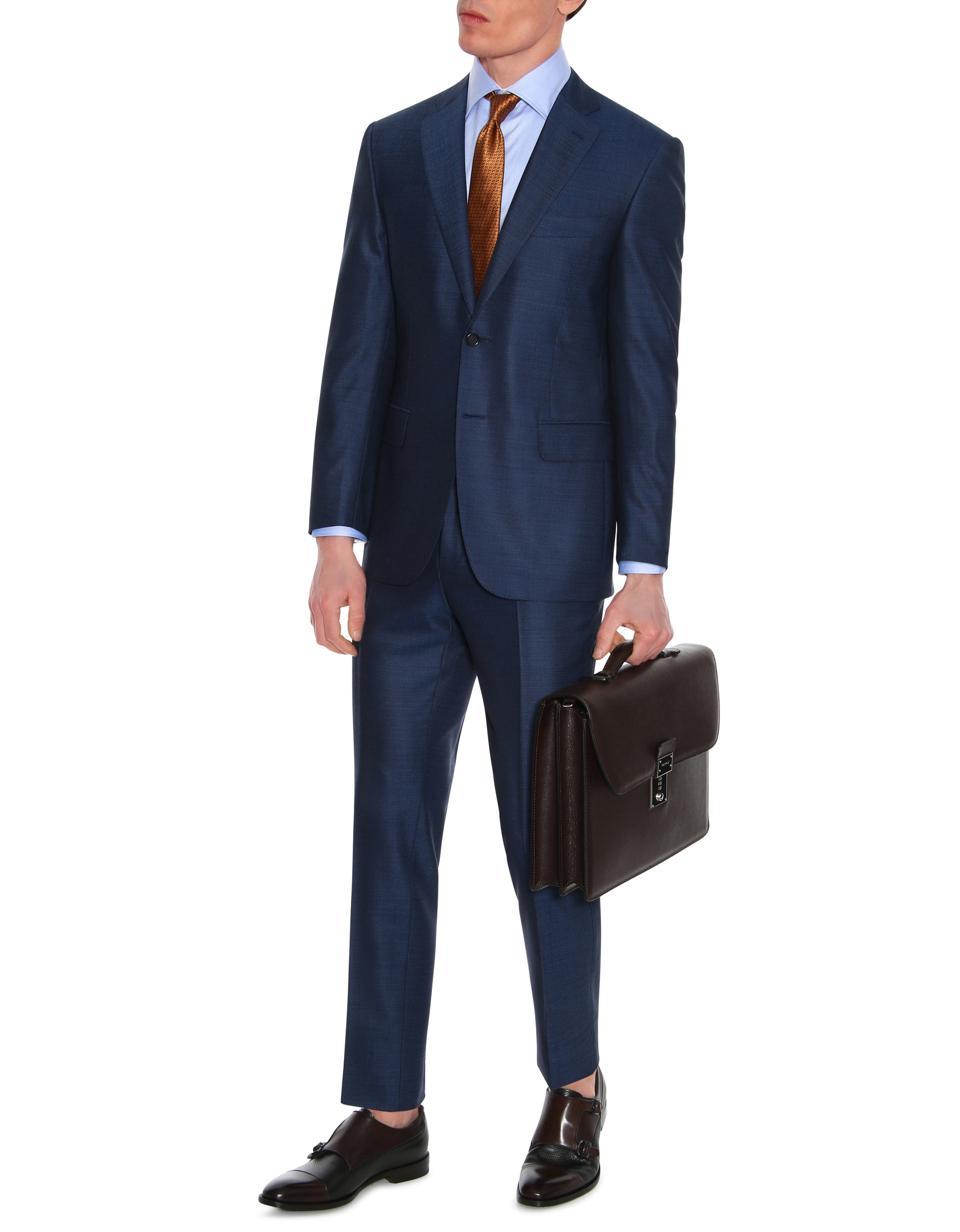 Canali: Made in Italy of 100% wool, this suit speaks to both classic tailoring and a heritage of suit making, with a contemporary silhouette and impeccable construction that will last a lifetime.