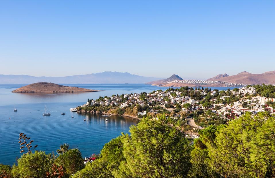 Scenic View Of Sea Against Clear Blue Sky