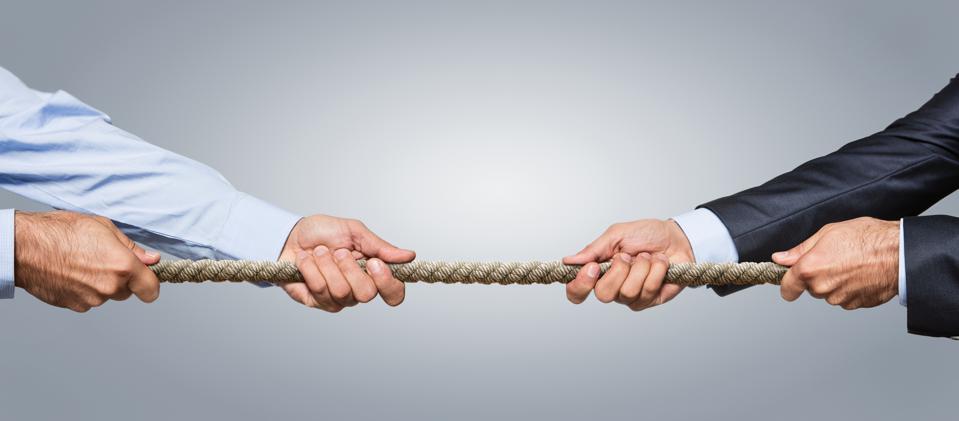 Business competition concept using tug-of-war