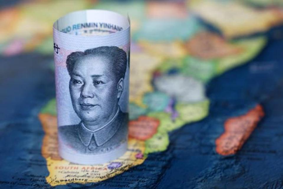 Chinese Yuan note atop a map of Africa