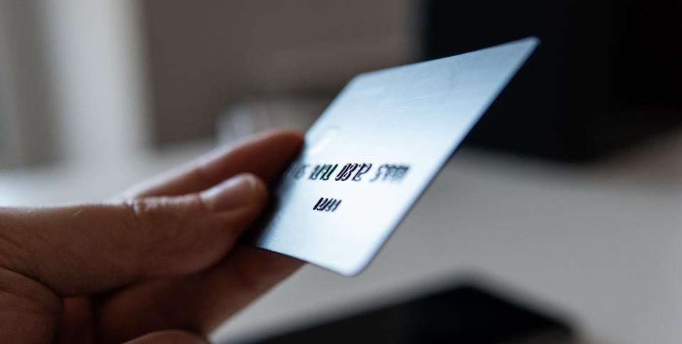 Cropped Hand Of Person Holding Credit Card