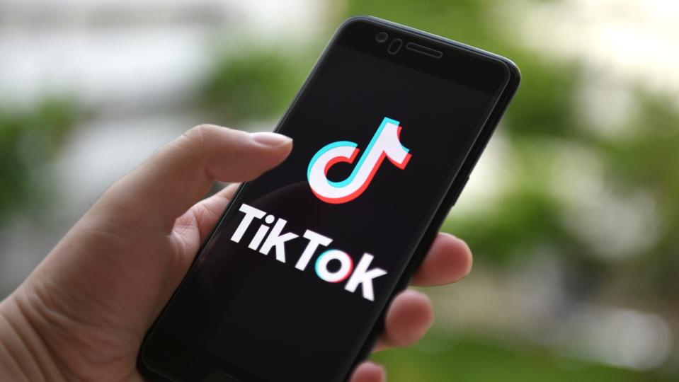 In this photo illustration a TikTok logo displayed on a...