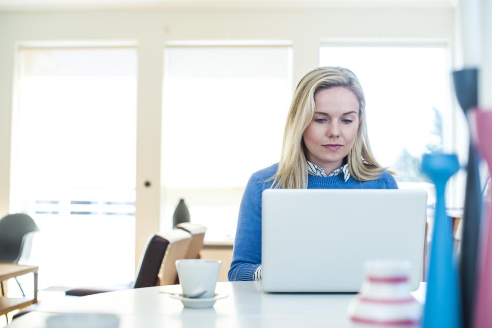 Lesbian woman using laptop at home