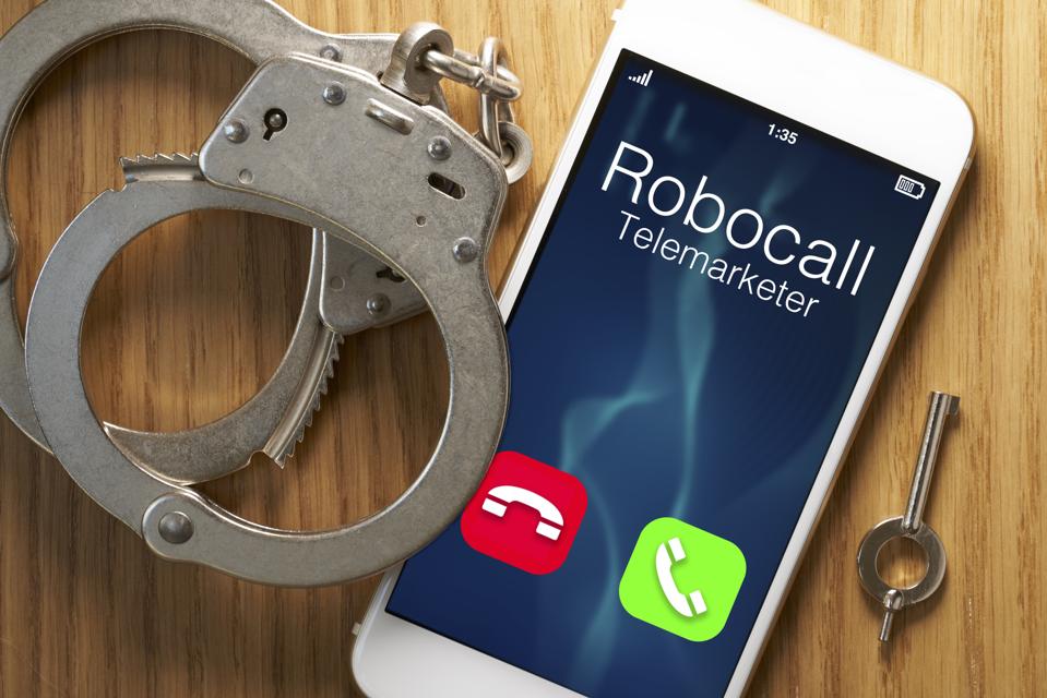 Telemarketer robocall scam: legislation for smartphone with gavel
