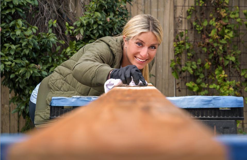 Jasmine Roth cutting wood