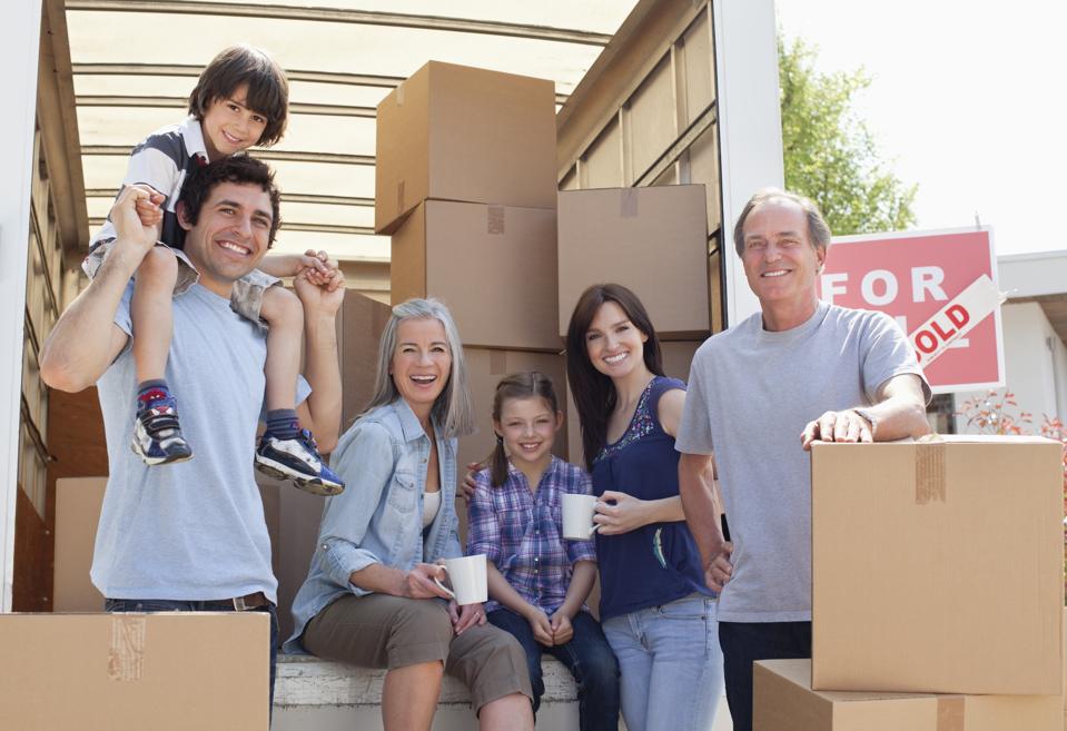 Family taking break near moving van