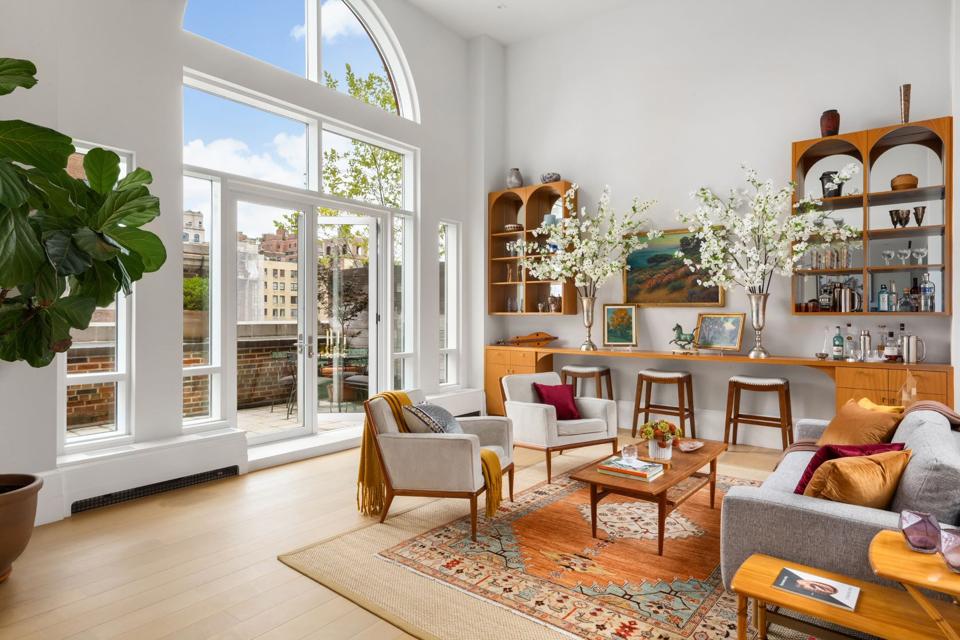 A living room with gray and gold decor.