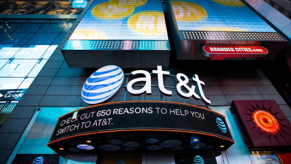 AT&T Inc. signage is displayed at the company's store in the Times Square area of New York, U.S., on Saturday, Oct. 22, 2016.