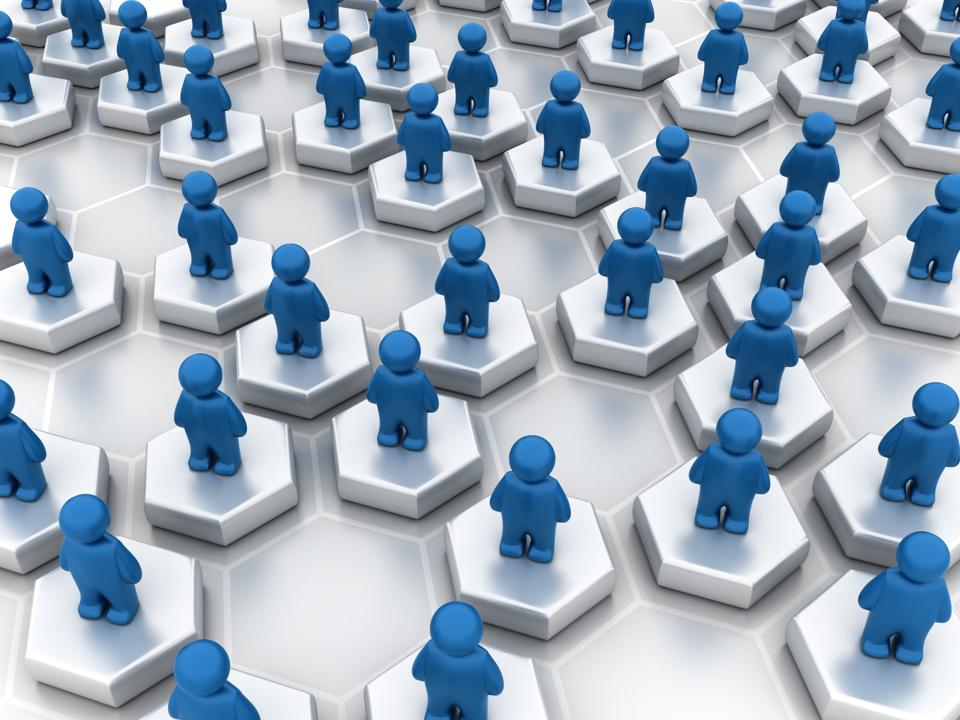 graphic of blue people figures standing on hexagons representing the concept of networking
