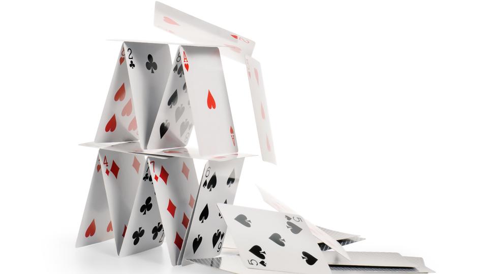 Falling house of cards isolated with clipping path