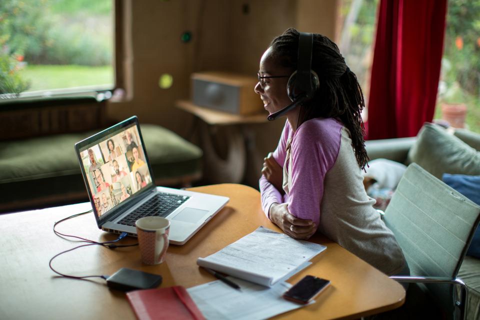 Woman works from home on remote virtual team during coronavirus quarantine