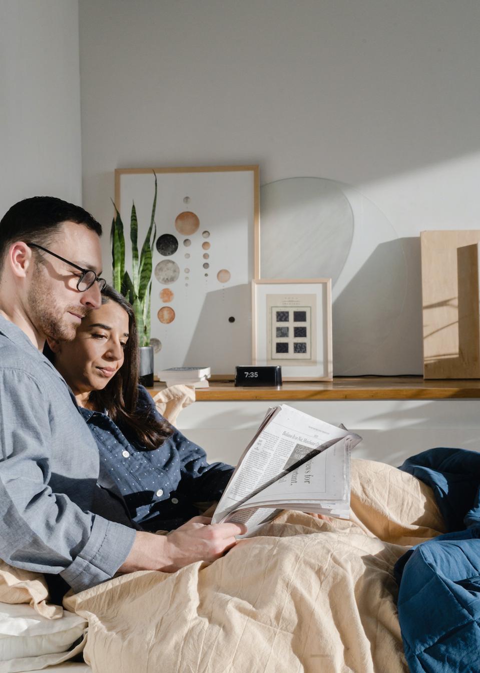 couple in bed with Loftie alarm clock
