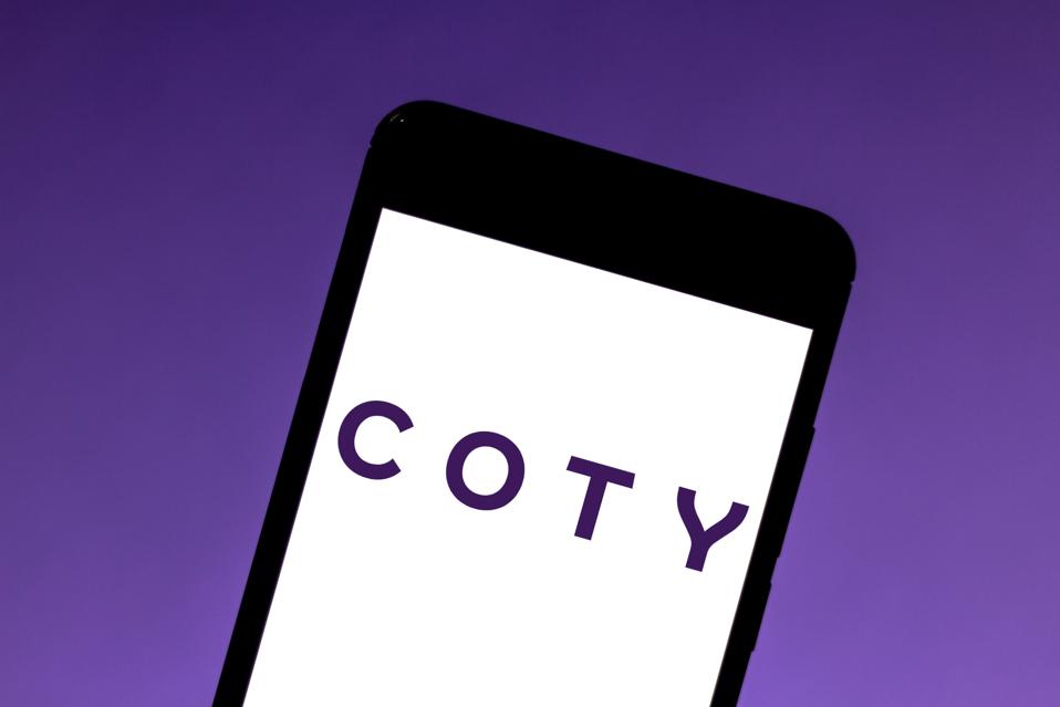 In this photo illustration the Coty logo is seen displayed...