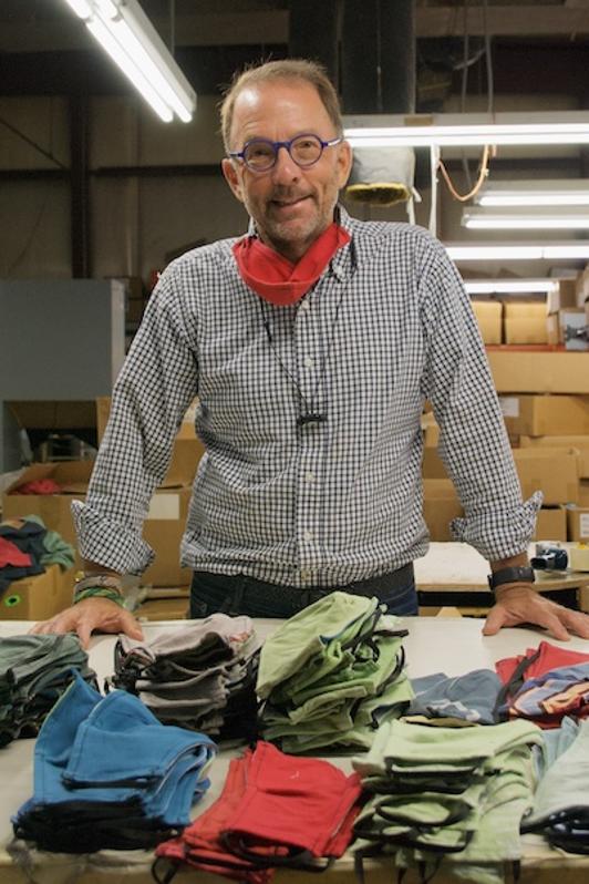 Eric Henry, CEO TS Designs with facial masks cut from t-shirts.