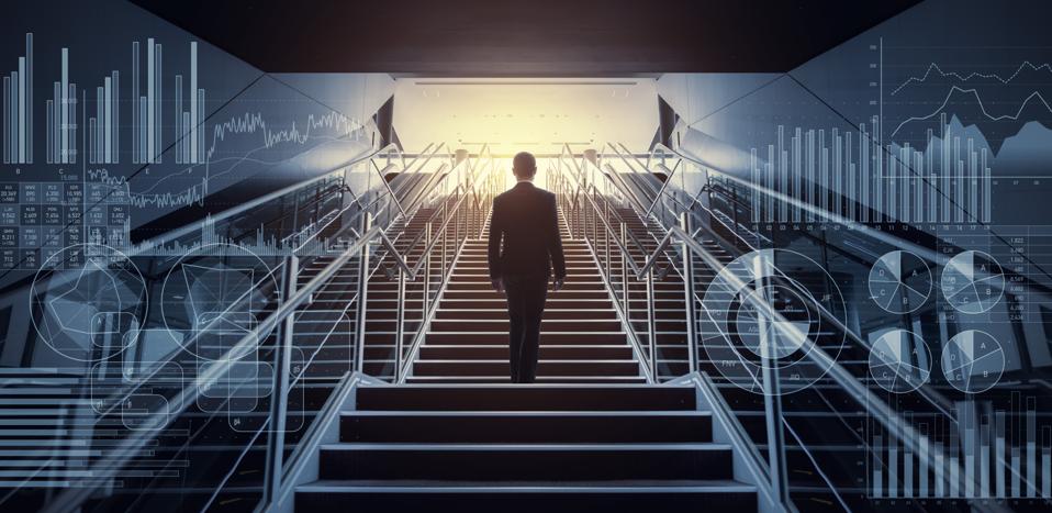 Businessman on staircase low angle view.