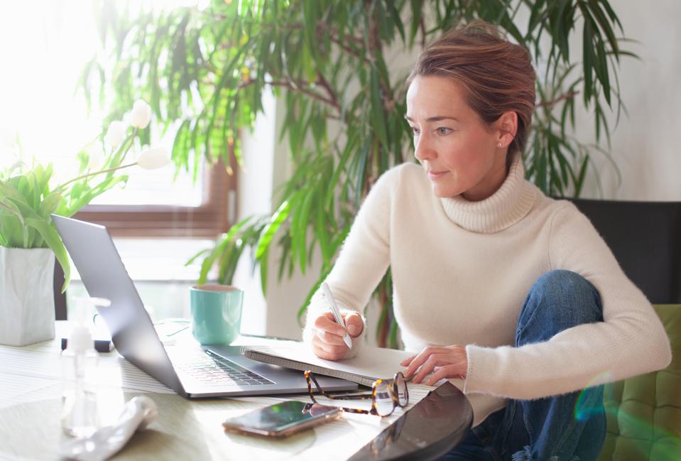 Woman working from home using laptop computer