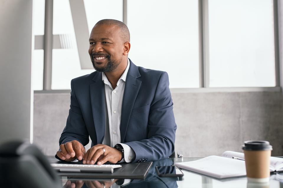 African businessman working on computer