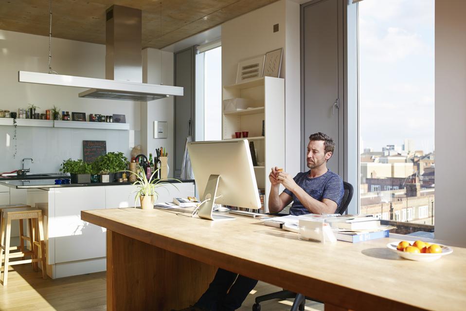 Many using computer in apartment