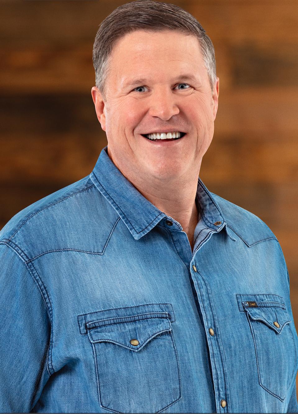 Headshot of Chris Waldek EVP, Global Brand President Lee wearing Lee denim shirt