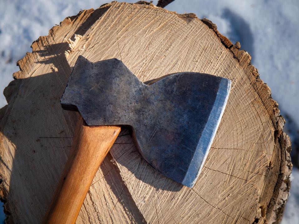 Antique axe with tree stump