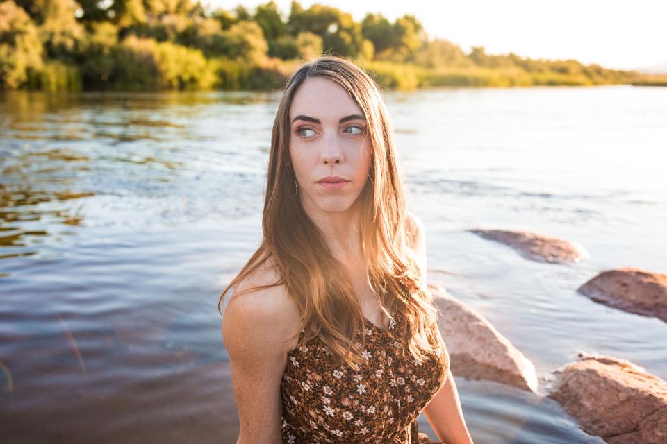 Lindsey Corum, CEO and Founder of Cannabombz, talks going viral on TikTok. Here she is pictured in front of a lake.