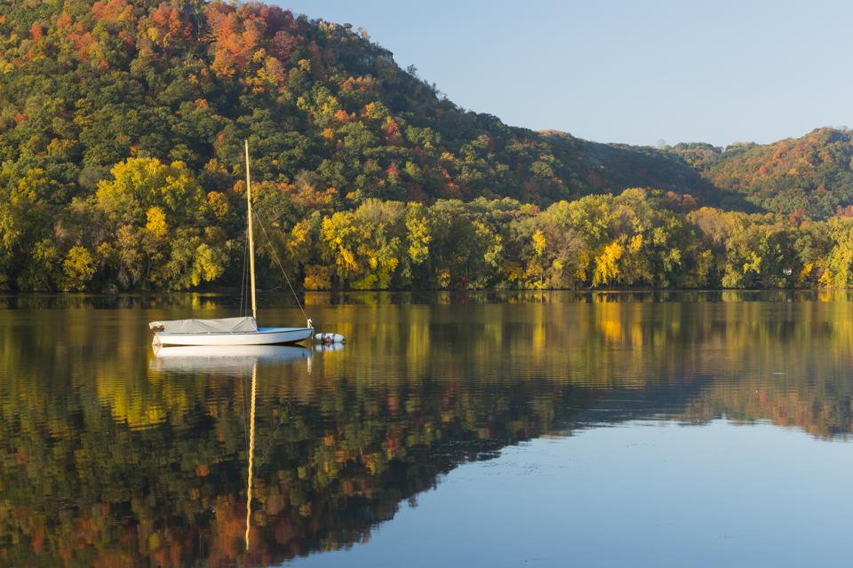 Lake Winona In Autumn with single sailboat