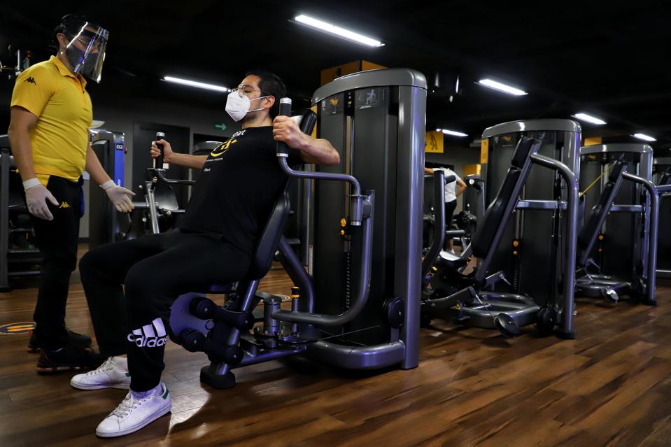 A gym worker and a gym member wearing protective masks in Mexico City, Mexico on 22 September 2020
