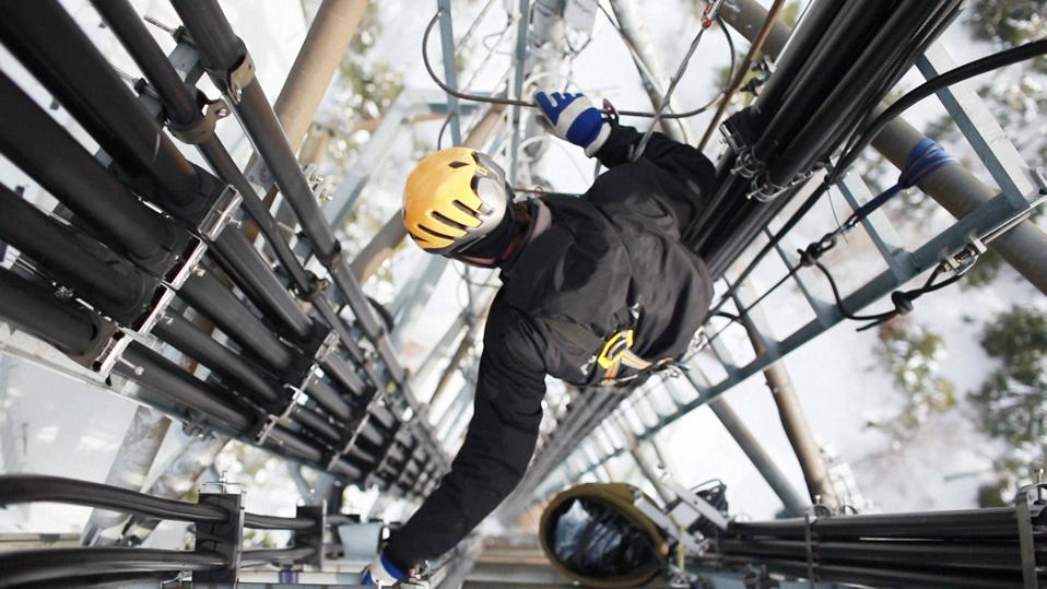 Telecommunication manual high worker engineer repairing antenna
