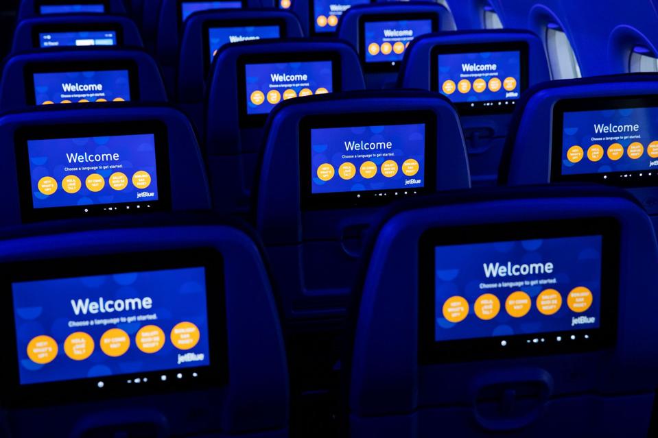 Jet Blue aircraft seatback screems.