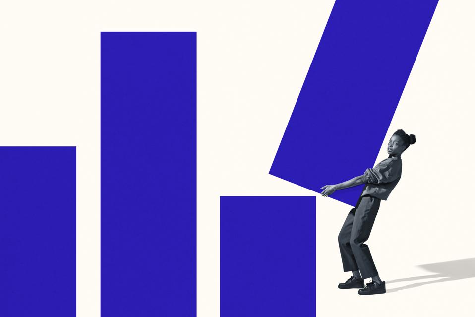 Portrait of woman carrying large blue bar graph