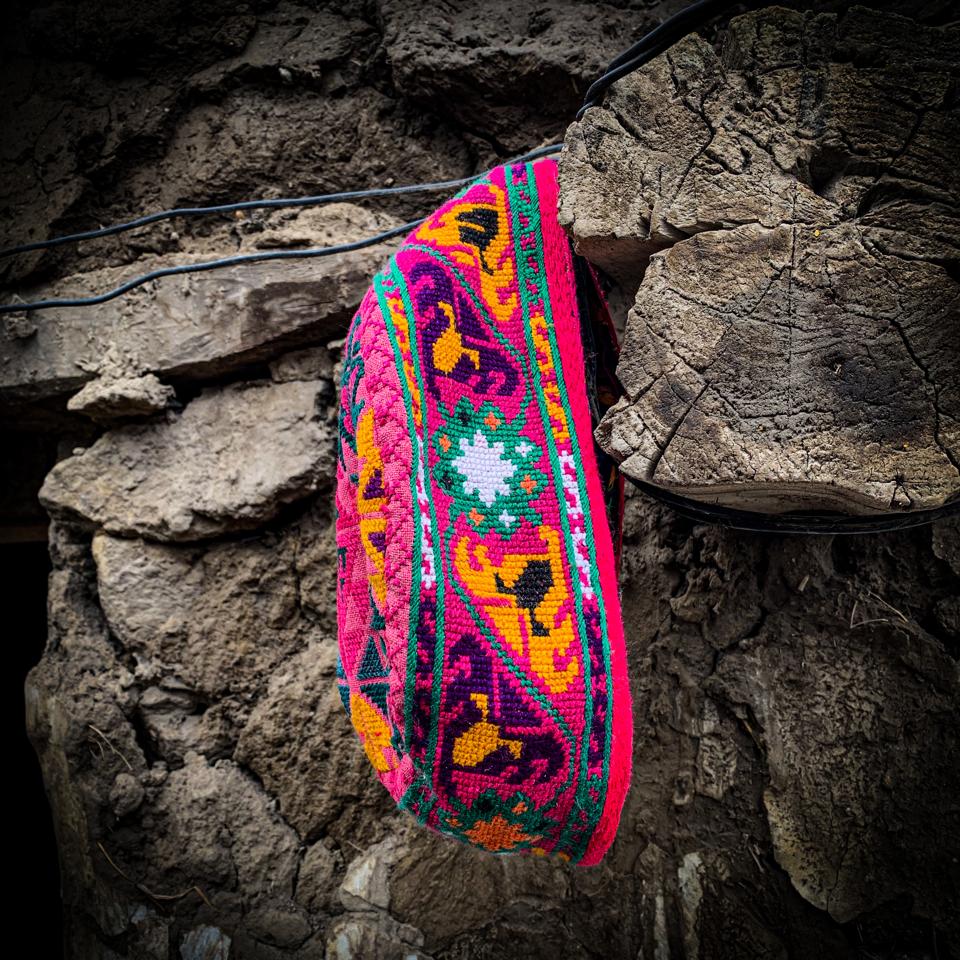 A traditional Chitrali embroidered Khoi (skull cap) made by an artisan in Chitral.