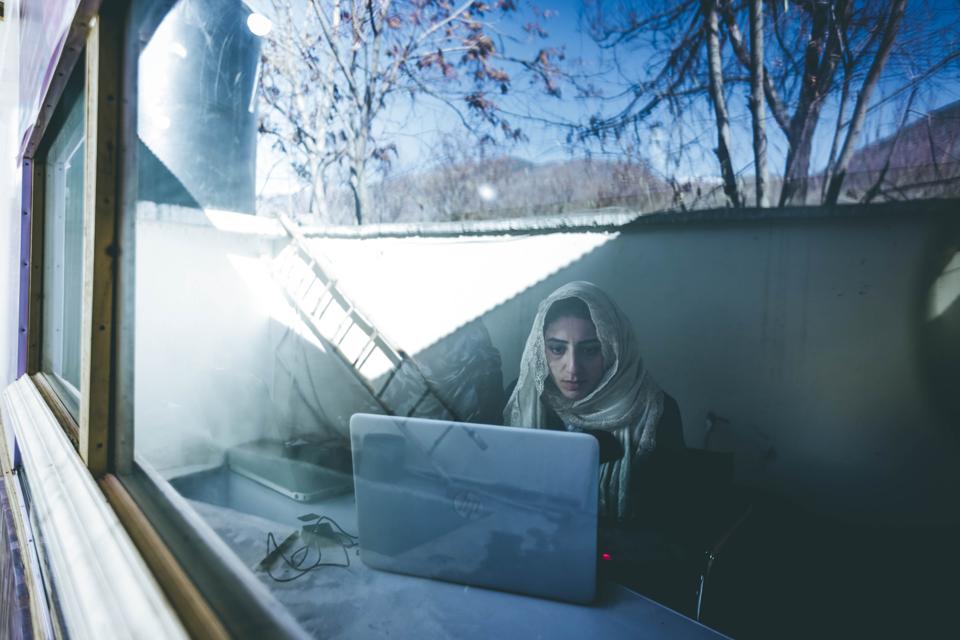 Atia Aman (a local volunteer) working at the Mahraka Center's internet café.