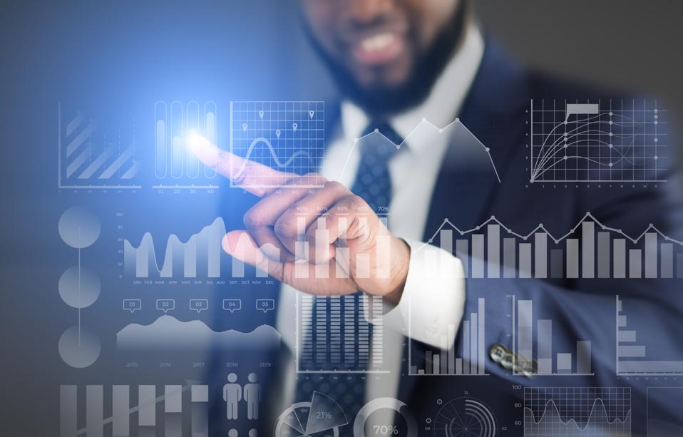 Businessman choosing with finger analytic diagram with data