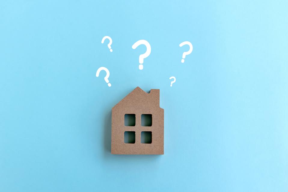 Wood House Model with question marks