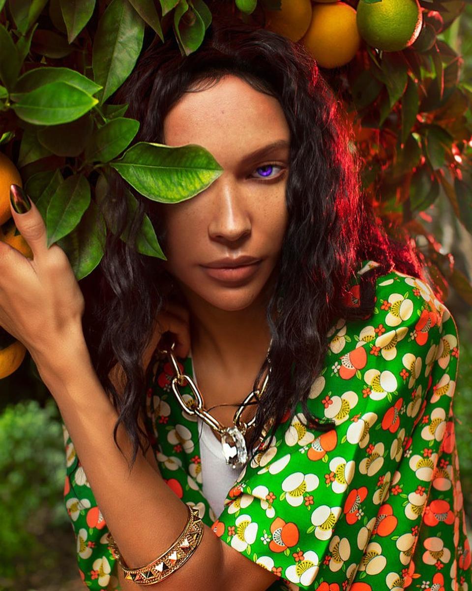 Aliza Rexx poses in bright green look on Instagram.