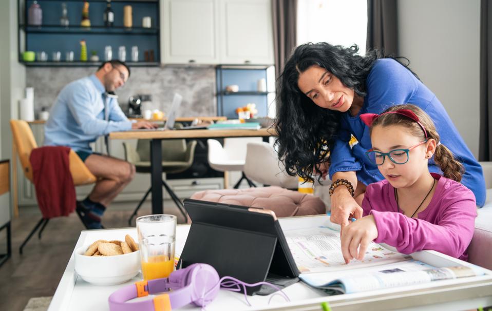 Family staying at home and doing distance learning and home office, during COVID-19