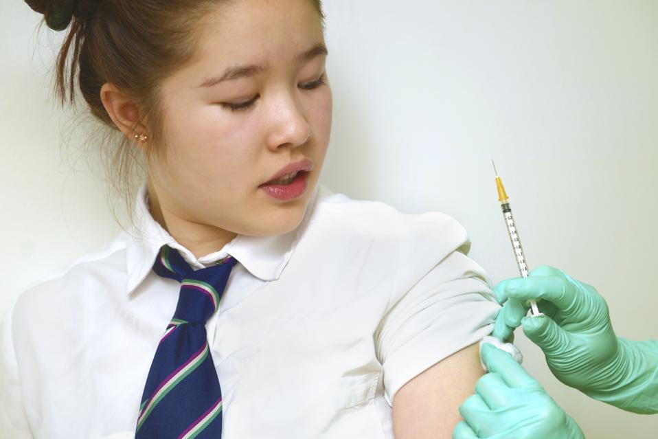 GIRL GETTING VACCINATED