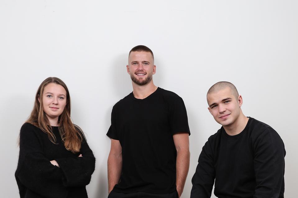 Eric Dier (center) stands with Spotals co-founders Zoe Connick (left) and Patrick Dier (right)