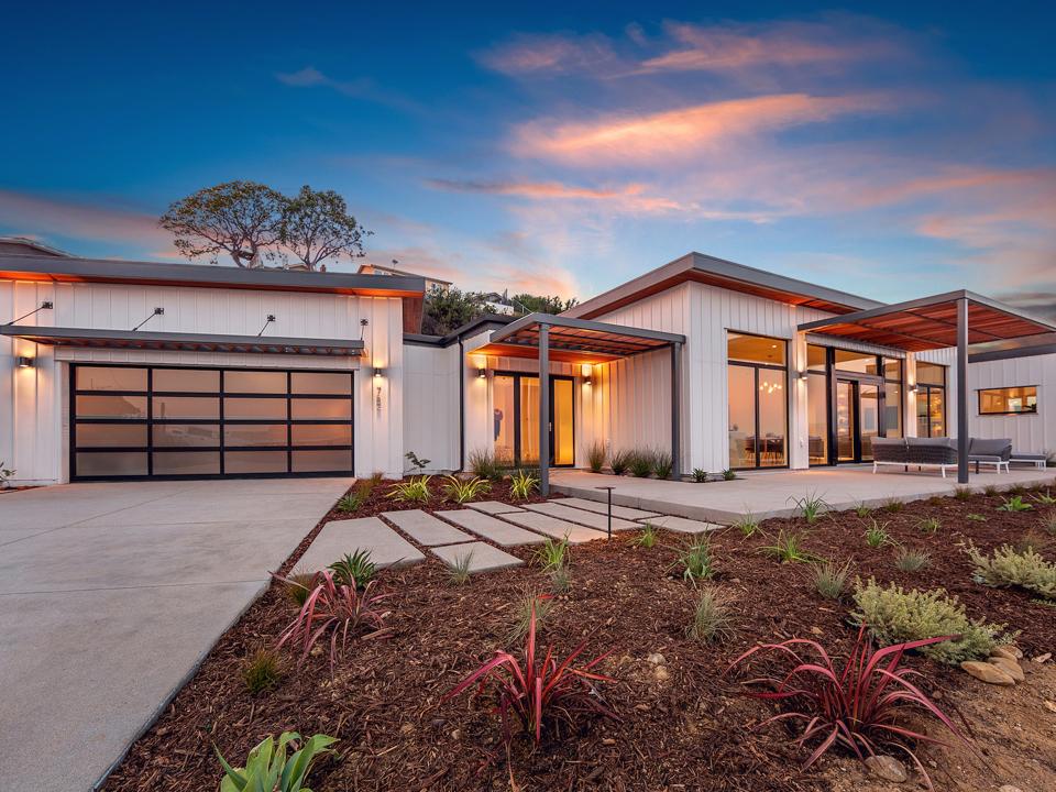 A Dvele home lit up at sunset.