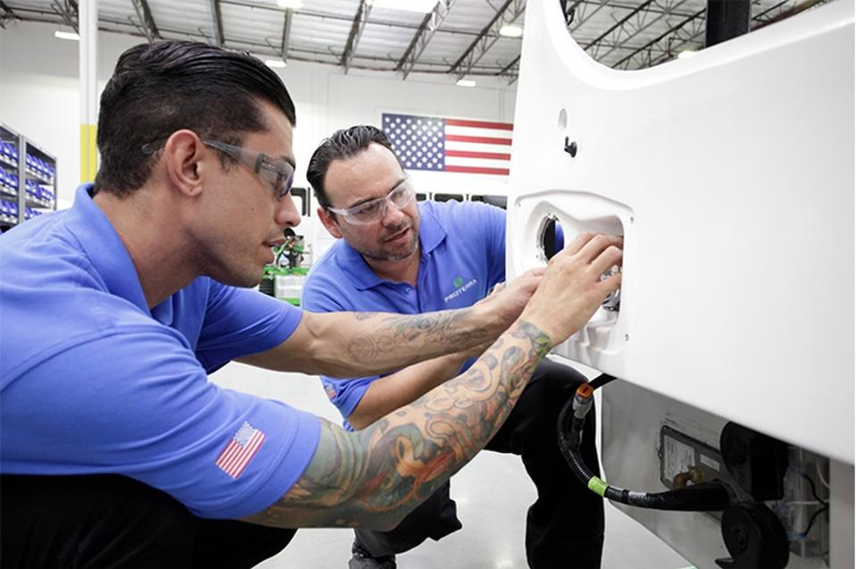 Worker training at an electric bus factory.