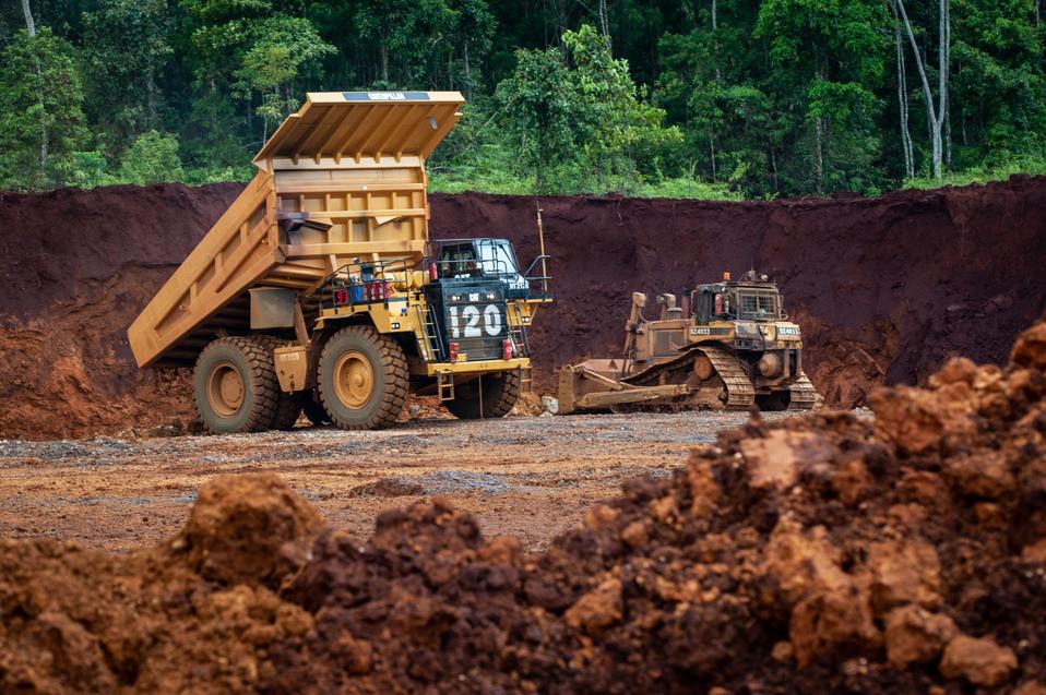 Heavy trucks seen working at the nickel mining area. Nickel...