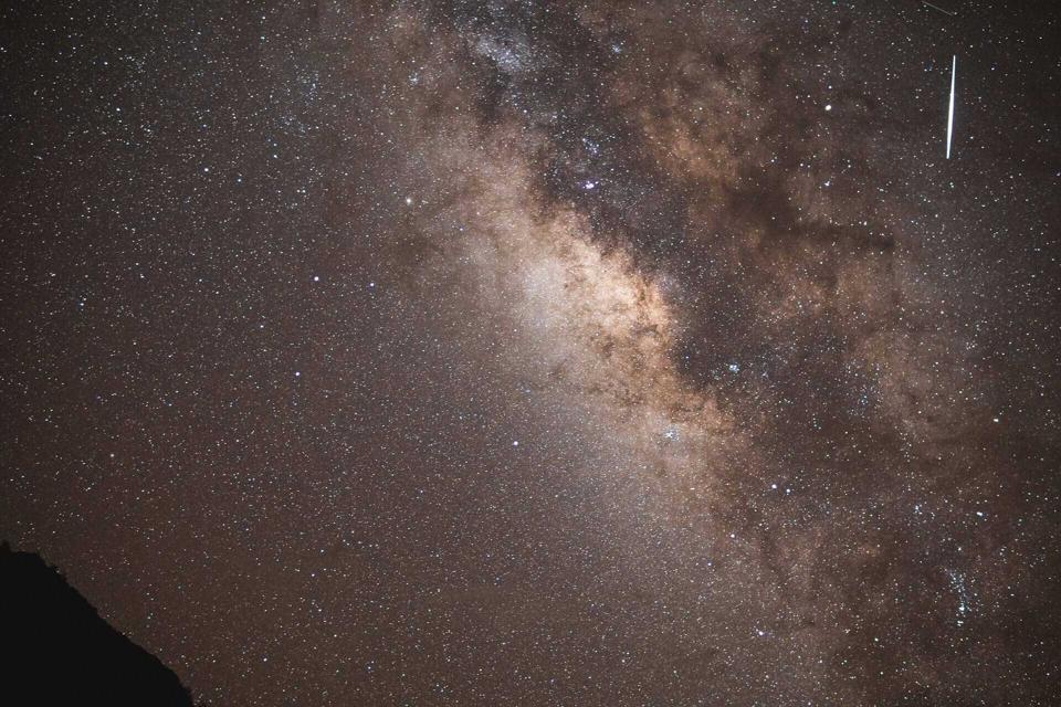 A meteor streaks over Lassen Volcanic National Park