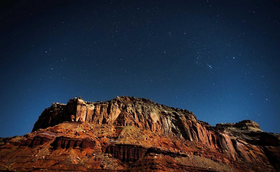 Orion and the stars above a formation in Canyonlands