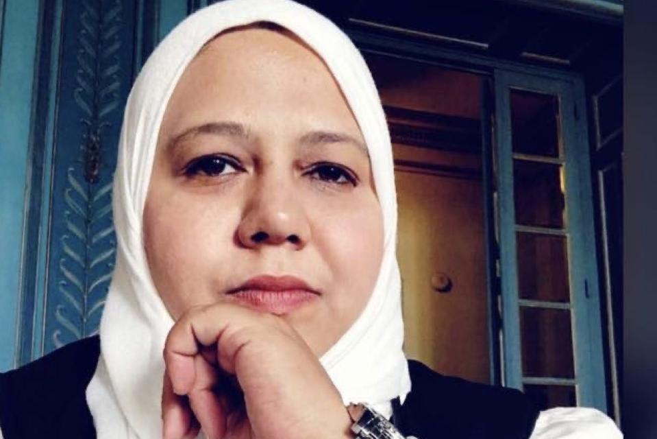 A woman in a headscard - Muna Luqman