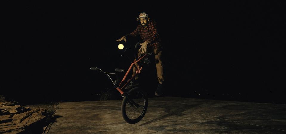 X Games Gold Medalist Terry Adams in the Arkansas Ozarks as the ″Harvest Moon″—the first full moon of fall—rises behind him.