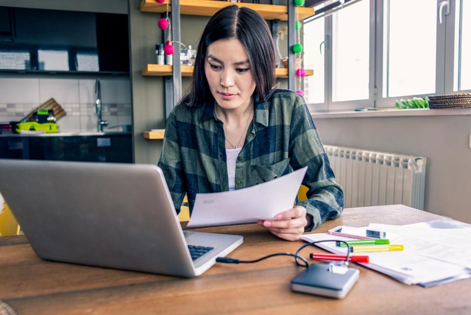 young woman working on her laptop