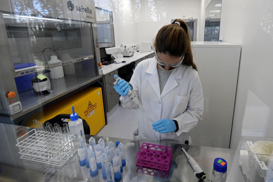 Scientists in labs making antibody treatments against COVID-19