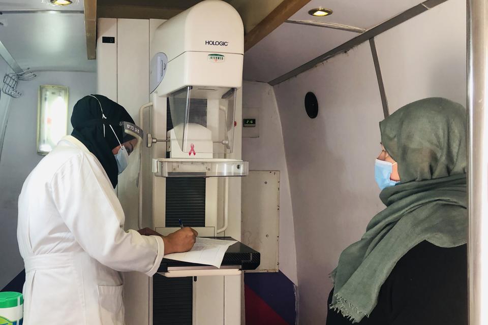 A mammography clinic with a nurse and a patient