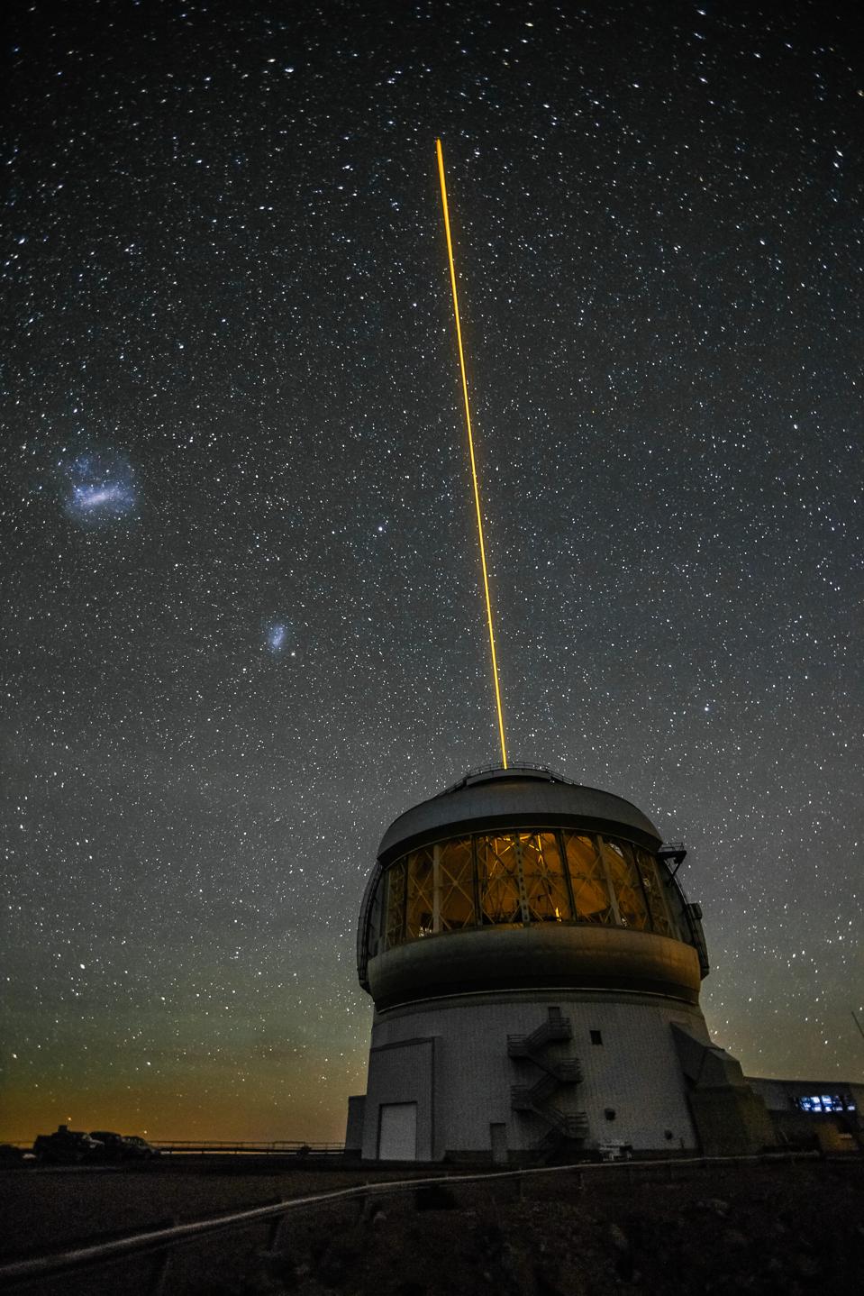 This exterior shot of Gemini South shows the result of the Gemini Multi-conjugate adaptive optics System (GeMS) with the Gemini South Adaptive Optics Imager (GSAOI) propagating a laser guide star toward the zenith.